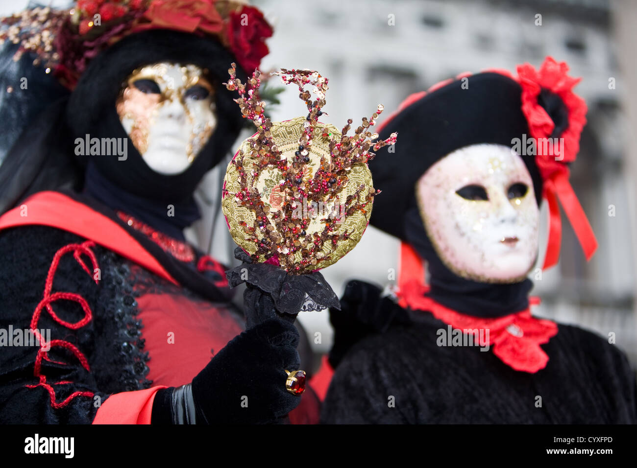Two people in costume at the Venice Carnival Stock Photo - Alamy