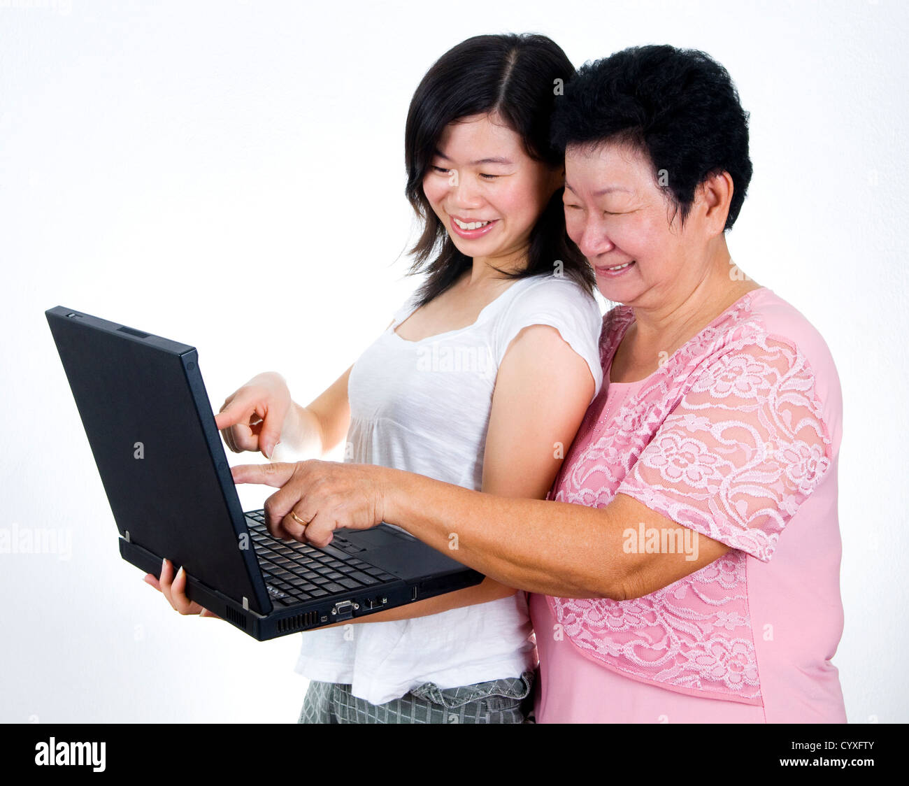 Senior mother and daughter sharing informations from internet. Stock Photo