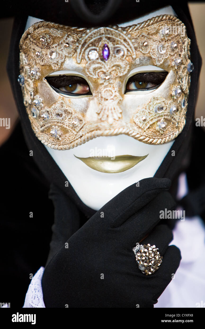 man in black costume with a golden mask Stock Photo Alamy