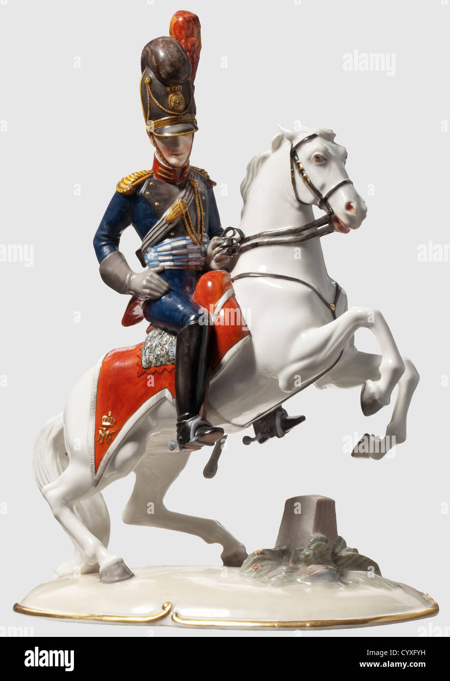 An artillery officer on horseback,of the Bavarian army in the 1st quarter of the 19th century Polychrome porcelain figure of the Nymphenburg Manufacture,after 1900. Green crowned underglaze mark at bottom and model number 776. Rearing horse with officer in blue-red uniform,tall helmet and detailed equipment. Monogram "MJ"(Max I. Joseph,1756 - 1825)on helmet and saddle blanket. Glazed painting. Sabre restored. Height 32 cm,historic,historical,people,1900s,20th century,Bavaria,Bavarian,German,Germany,Southern Germany,the South of Germany,object,,Additional-Rights-Clearences-Not Available Stock Photo