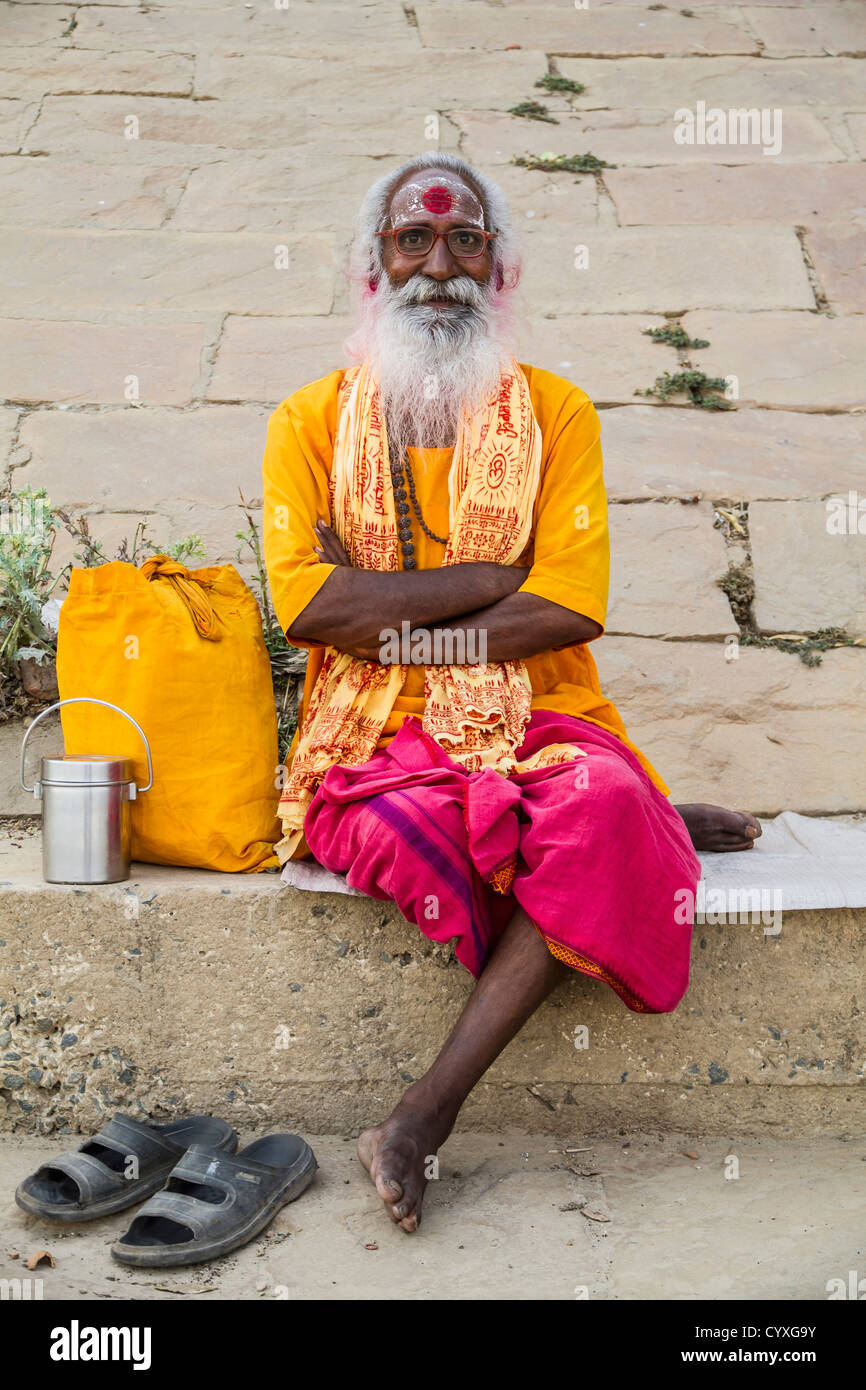 India, Uttar Pradesh, Varanasi, Indian Brahmin sitting at Ganges ghats Stock Photo