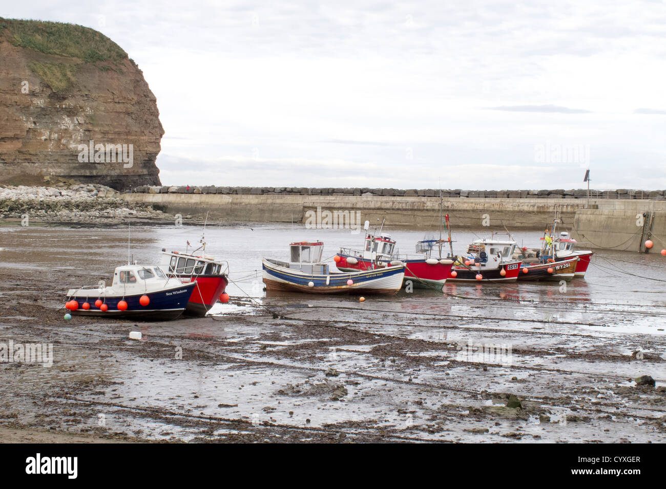tide out and fishing boats at Staithes - North Yorkshire Stock Photo ...