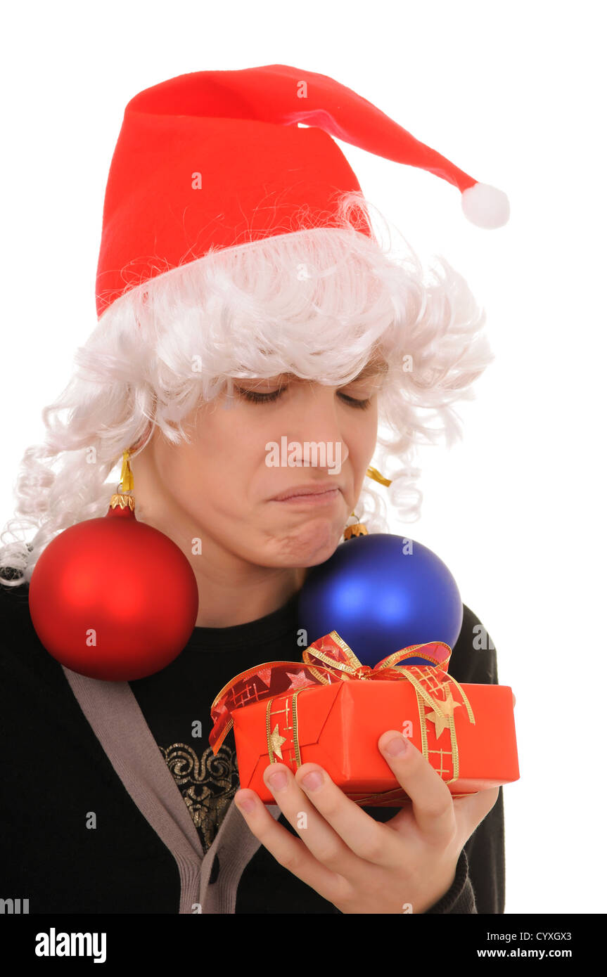 teenager in hat santa claus  and the spheres in ears isolated on white background Stock Photo