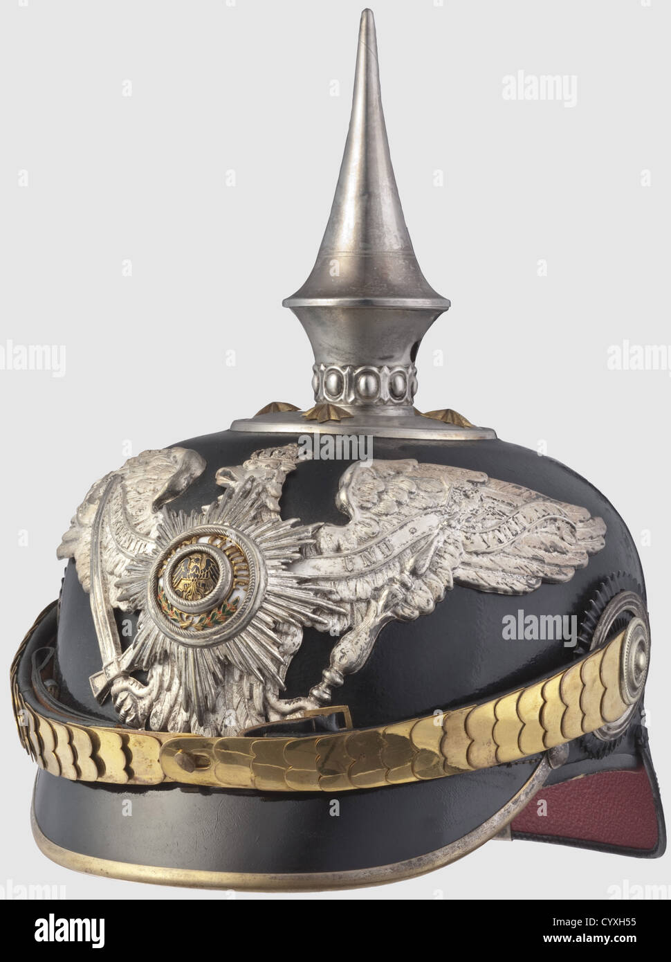 A helmet for officers,of the Prussian Guard Pioneer Batallion Black leather skull,enamelled Prussian Guard Star on a frosted silver eagle emblem,silvered spike and four officerïs stars on the base plate,flat gilt chin scales. Green ribbed silk liner,size '55' as well as an old pencil notation 'Garde Pioniere'. In a helmet box,lightly damaged. An extremely rare helmet in unusually good condition,historic,historical,19th century,Prussian,Prussia,German,Germany,militaria,military,object,objects,stills,clipping,clippings,cut out,cut-out,cut-o,Additional-Rights-Clearences-Not Available Stock Photo