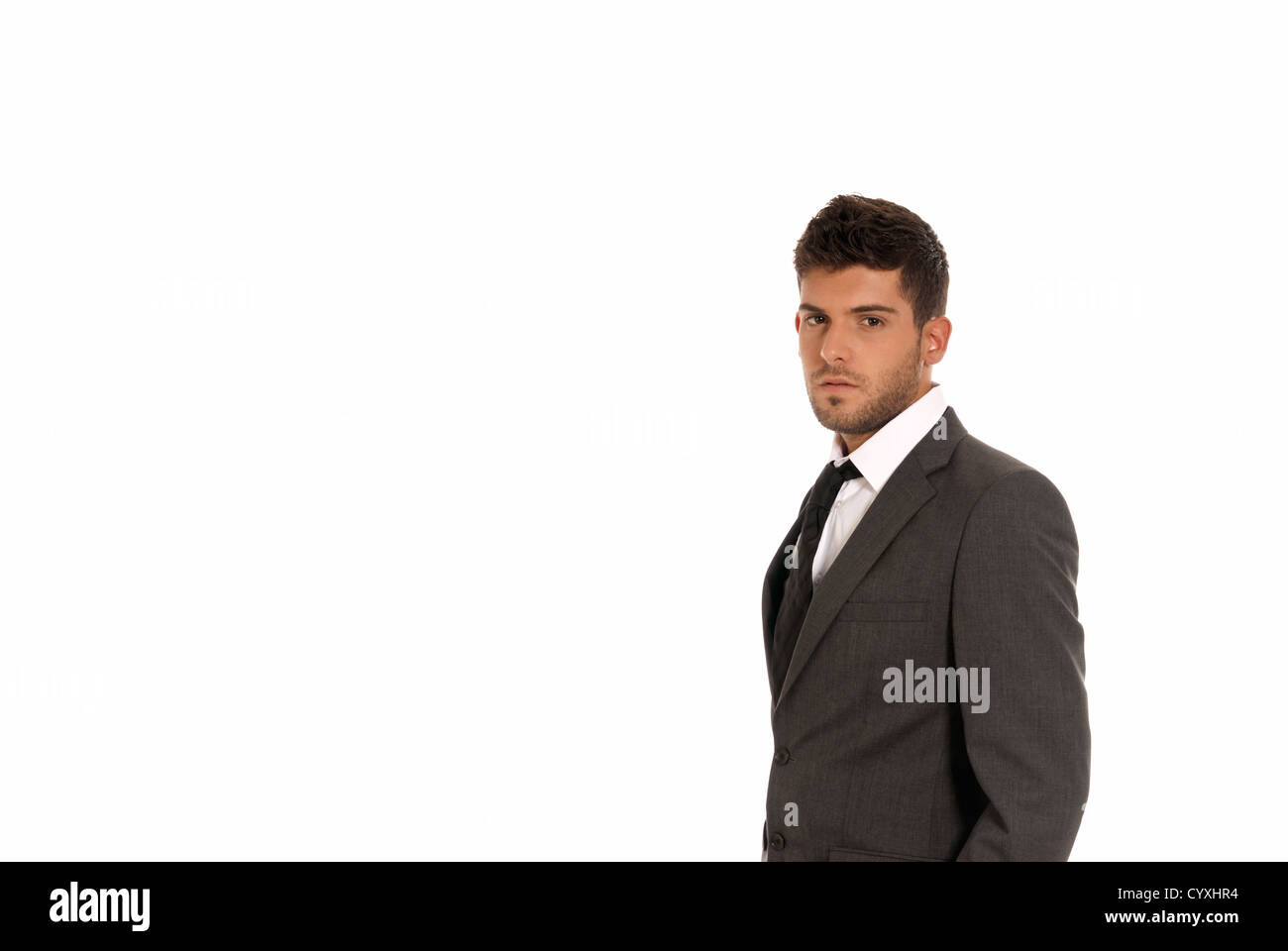 Young businessman with copy-space looking serious isolated on white background Stock Photo