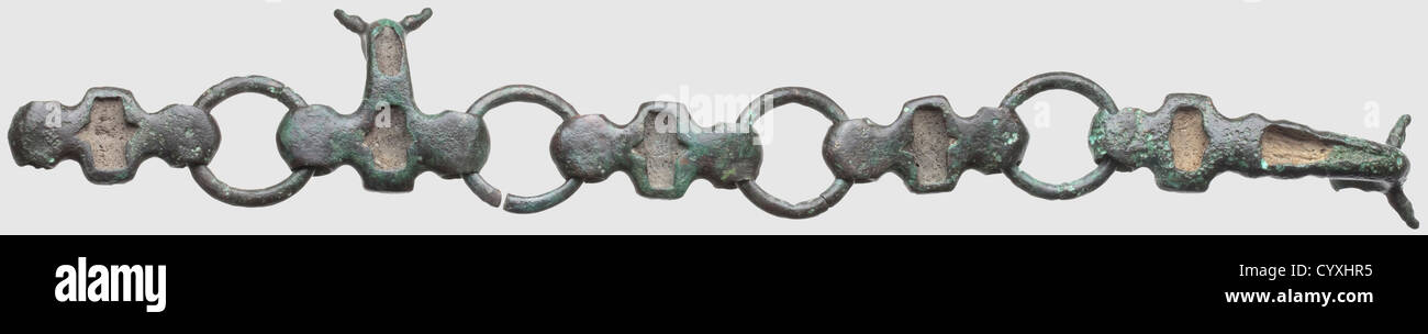 A piece of a Celtic sword belt, 5th - 3rd century BC. Bronze with green-black patina. Four rings attached by baluster shaped, bridging pieces. Two of those pieces have fastening or suspension hooks in the shape of an ox head with traces of enamel. Length 34 cm. Provenance: Southern German private collection, acquired in the 70s and later, historic, historical, ancient world, ancient world, ancient times, object, objects, stills, clipping, cut out, cut-out, cut-outs, mediterranean, precious metal, precious metals, jewellery, jewelry, noble, precious, Additional-Rights-Clearences-Not Available Stock Photo