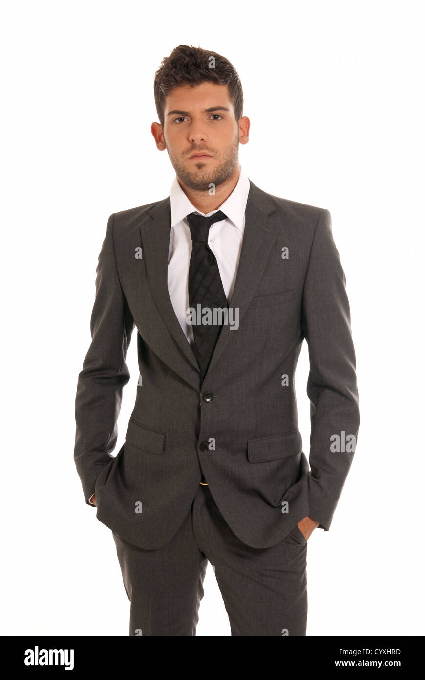Young businessman looking serious hands in pockets isolated on white background Stock Photo