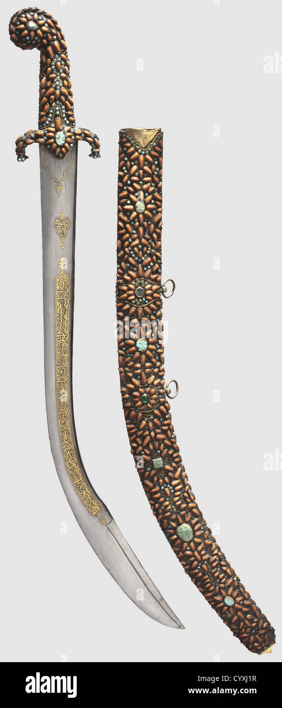 An Ottoman kilij set with coral and turquoise,mid-19th century Broad blade with a T-shaped reinforced back and a wider double-edged point.The maker's cartouche is inlaid in gold at base of blade on obverse side,and both sides display a long golden inscription with pseudo-date '1112'(=1701).The entire surfaces of copper gilded grip and quillons are set with turquoise cabochons and drop-shaped cut corals.The obverse side of gilded copper scabbard is decorated en suite,and reverse side is embossed with floral designs on a punched,Additional-Rights-Clearences-Not Available Stock Photo