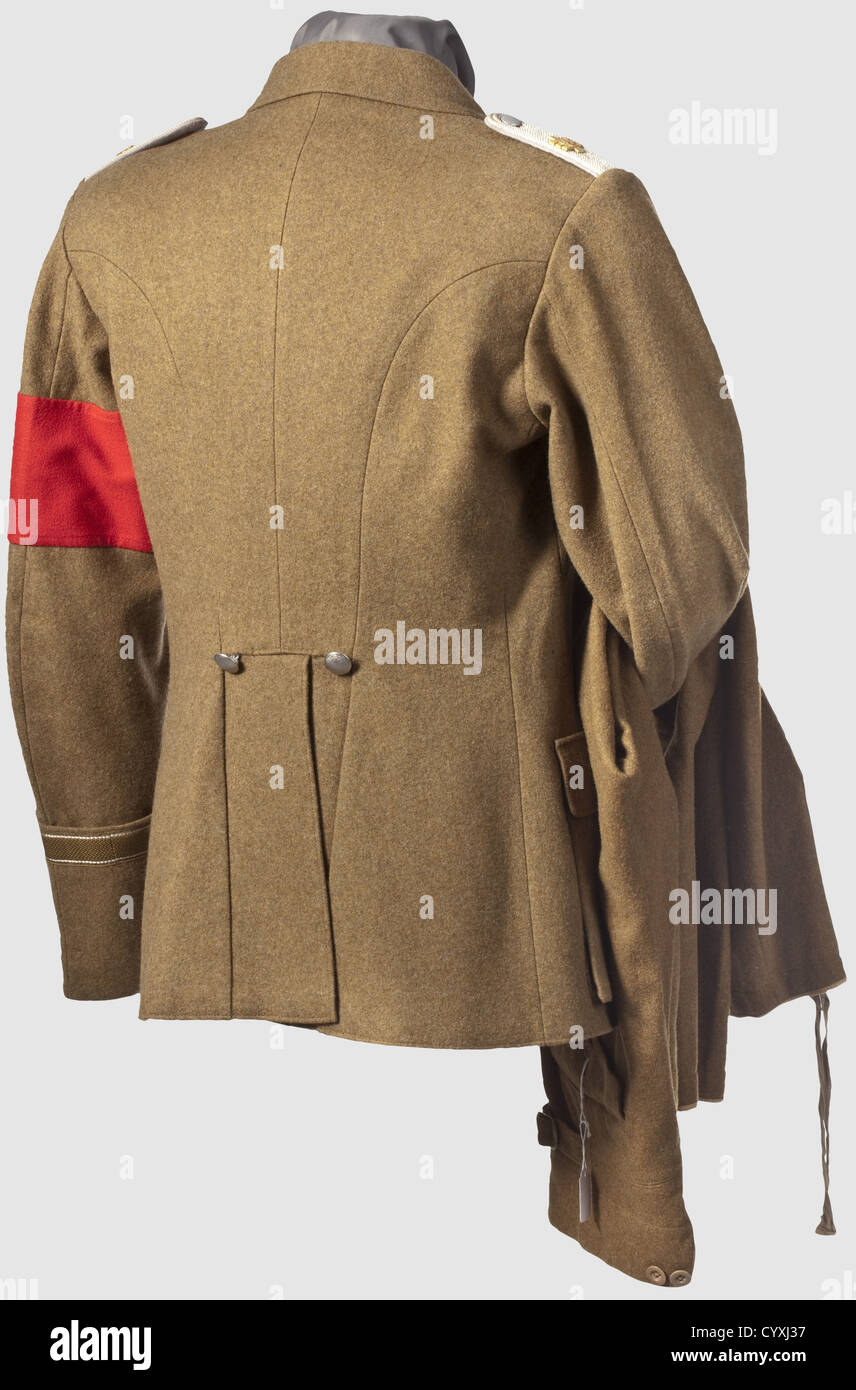 SA Standarte Feldherrnhalle,a uniform of an Untersturmführer The coat made of olive-brown cloth,brown silk liner,the carmine red collar patches with continuous cellon cording,the right patch with an applied Wolfsangel with SA emblem,the left patch with stars of rank.The shoulder boards with grey underlay and applied emblem of the Standarte Feldherrnhalle.BeVo weave cuff band with lettering 'Feldherrnhalle',sleeve band,EK2 ribbon and a few orders loops.Included are the riding breeches with leg ties,the silk liner with RZM tag 'SA-Stiefelhose',histori,Additional-Rights-Clearences-Not Available Stock Photo