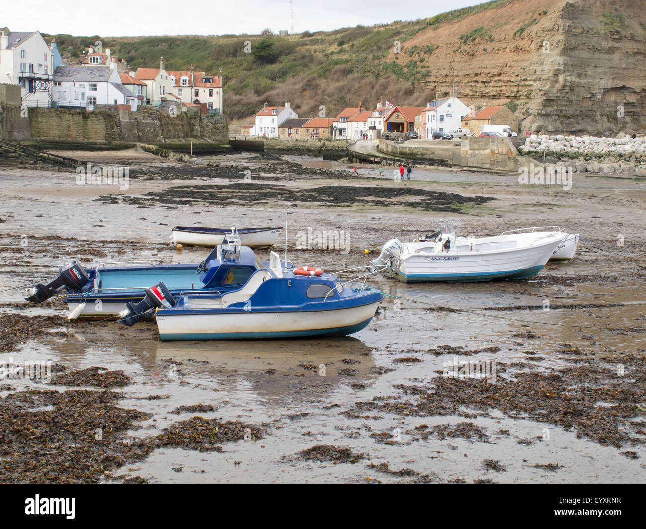 tide out and fishing boats at Staithes - North Yorkshire Stock Photo ...