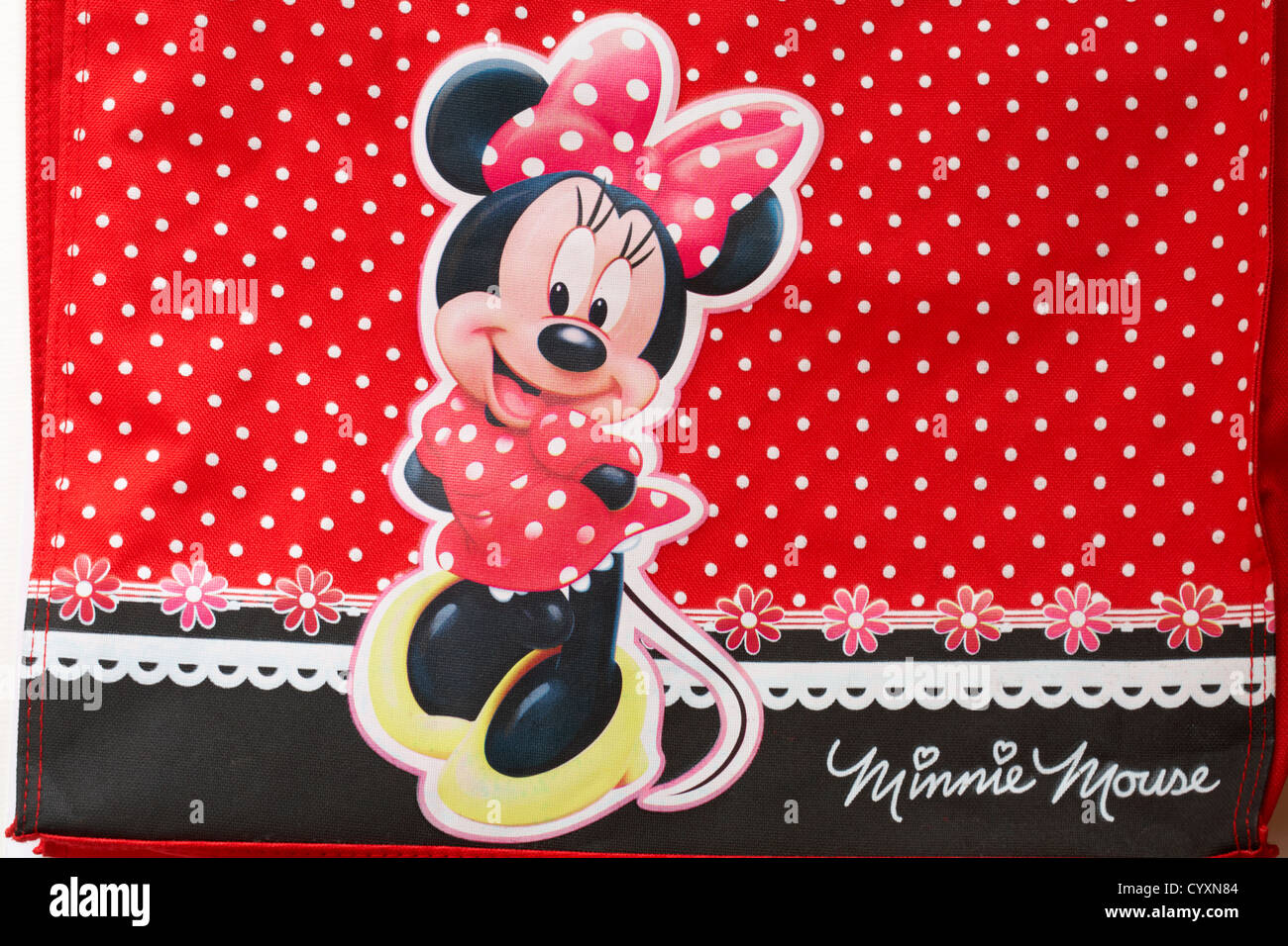 Detail of Minnie Mouse on colourful red polka dot shopping bag Stock Photo