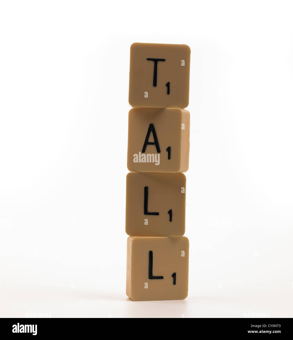 Stacked scrabble tiles spelling TALL Stock Photo Alamy
