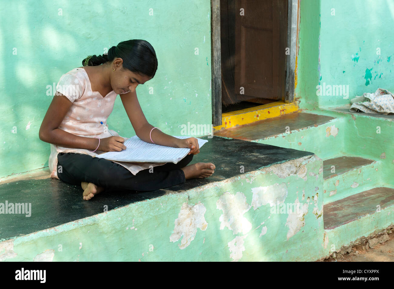 Teenage Indian village girl writing English in school book. Andhra  Pradesh.India Stock Photo - Alamy