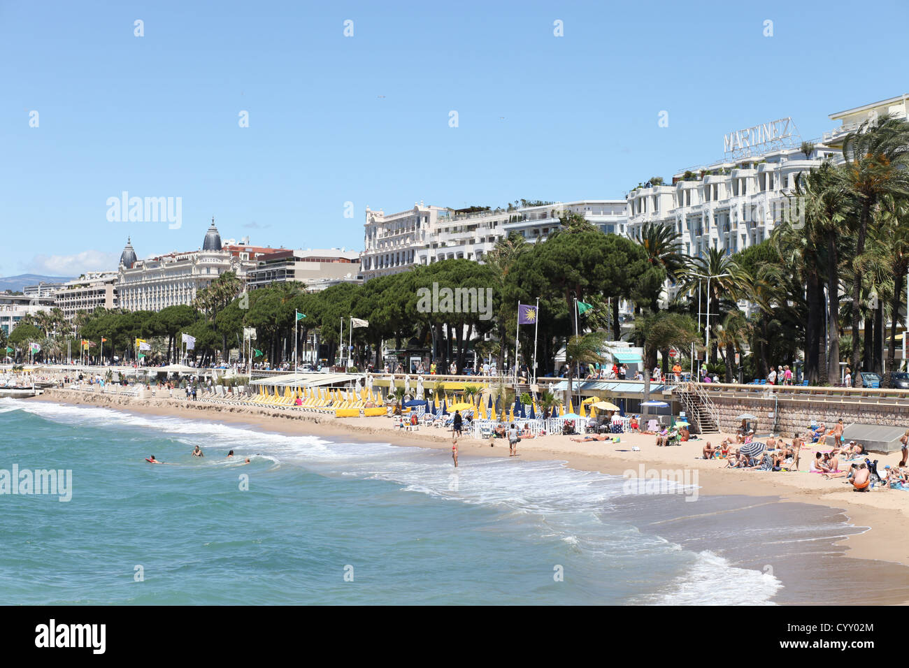 Cannes Seafront showing mountain back drop beach and water Stock Photo ...