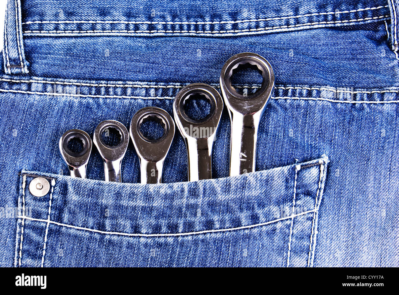 Five wrenches in a blue jeans pocket Stock Photo