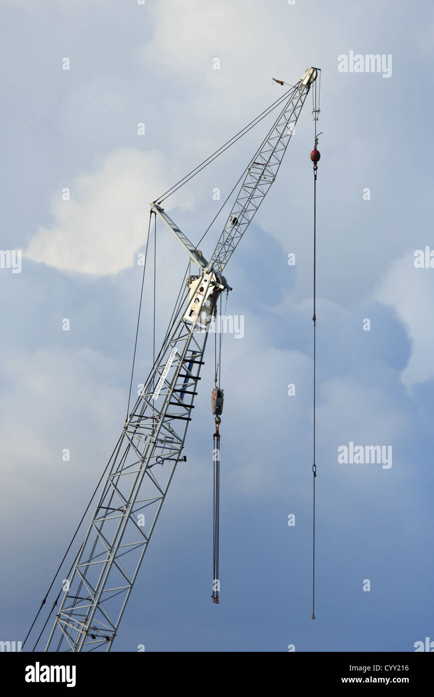 Hoist chains of a construction crane against cloudy sky Stock Photo - Alamy