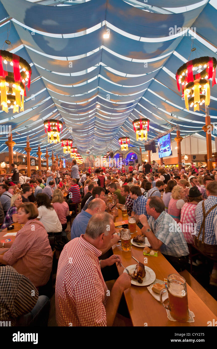 Germany, Baden Wuerttemberg, Stuttgart, People at beer tent celebrating traditional festival Stock Photo
