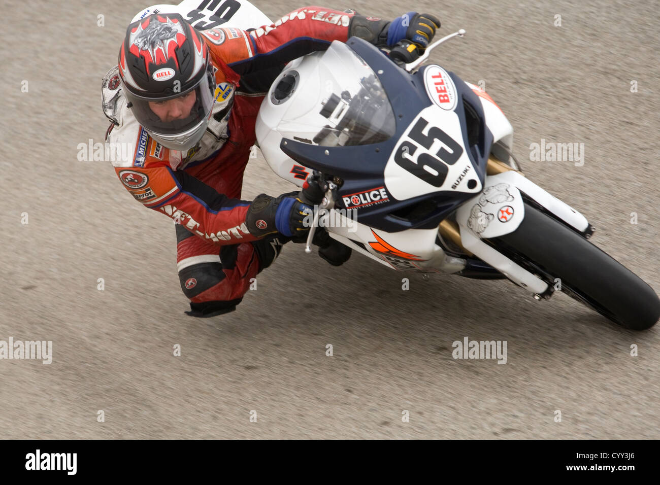 A motorcyclist races on a track at WIllow Springs International Raceway in California. Stock Photo