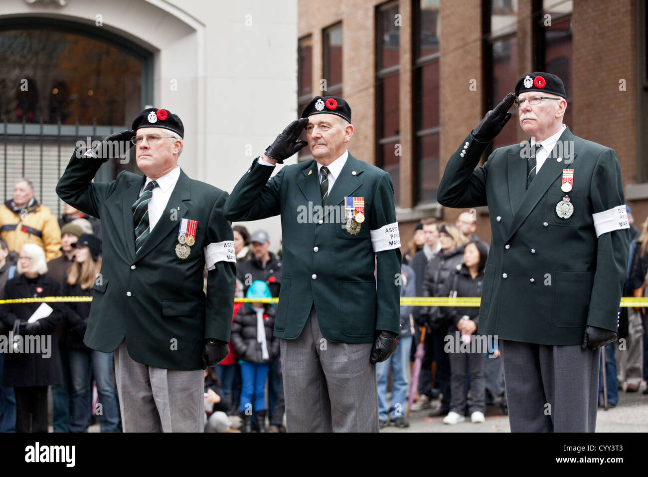 Three ex-servicemen stand on guard on Remembrance day near the Cenotaph in Vancouver's Victory Square. Stock Photo