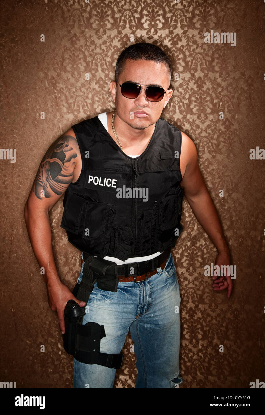 Police Officer with Gun Strapped to His Thigh Stock Photo