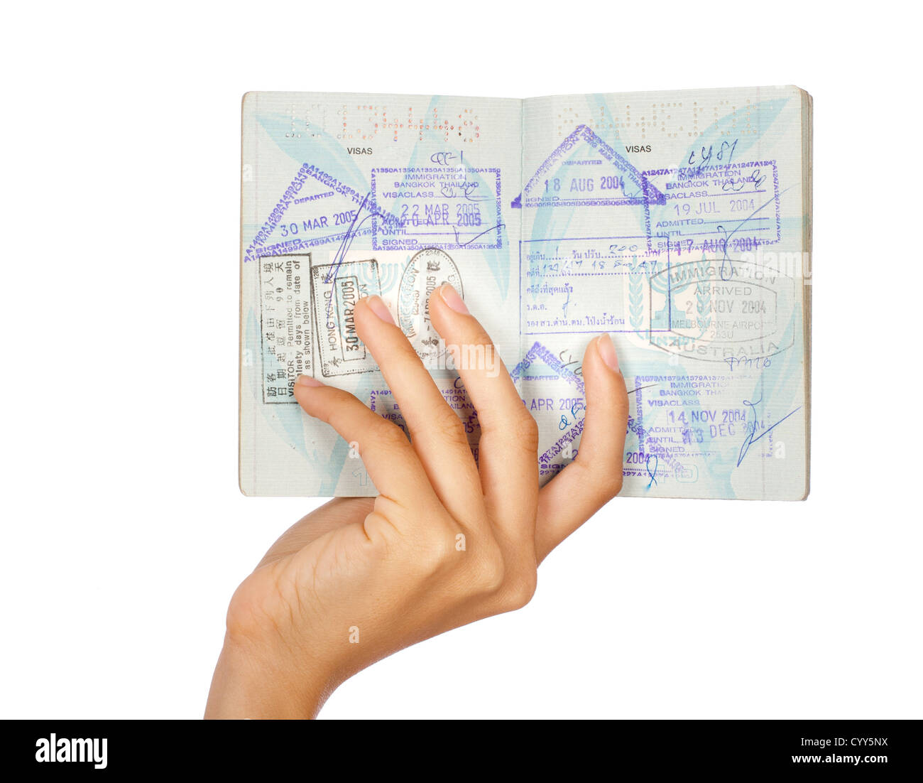 Hand showing passport, close-up shot. Isolated over white background. Stock Photo