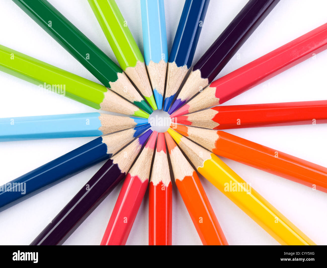 A circle formed by the points of several colored pencils. Stock Photo