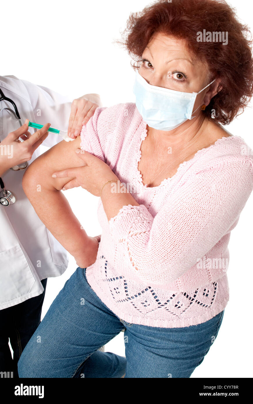 Senior woman getting flu vaccine on white background. Stock Photo