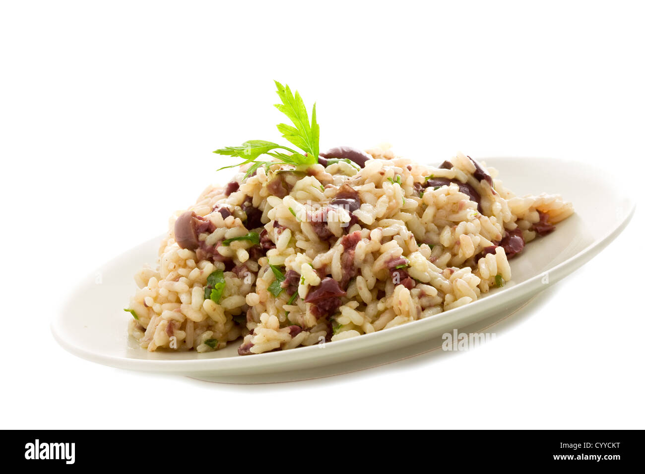 delicious risotto with black olives on white isolated background Stock ...