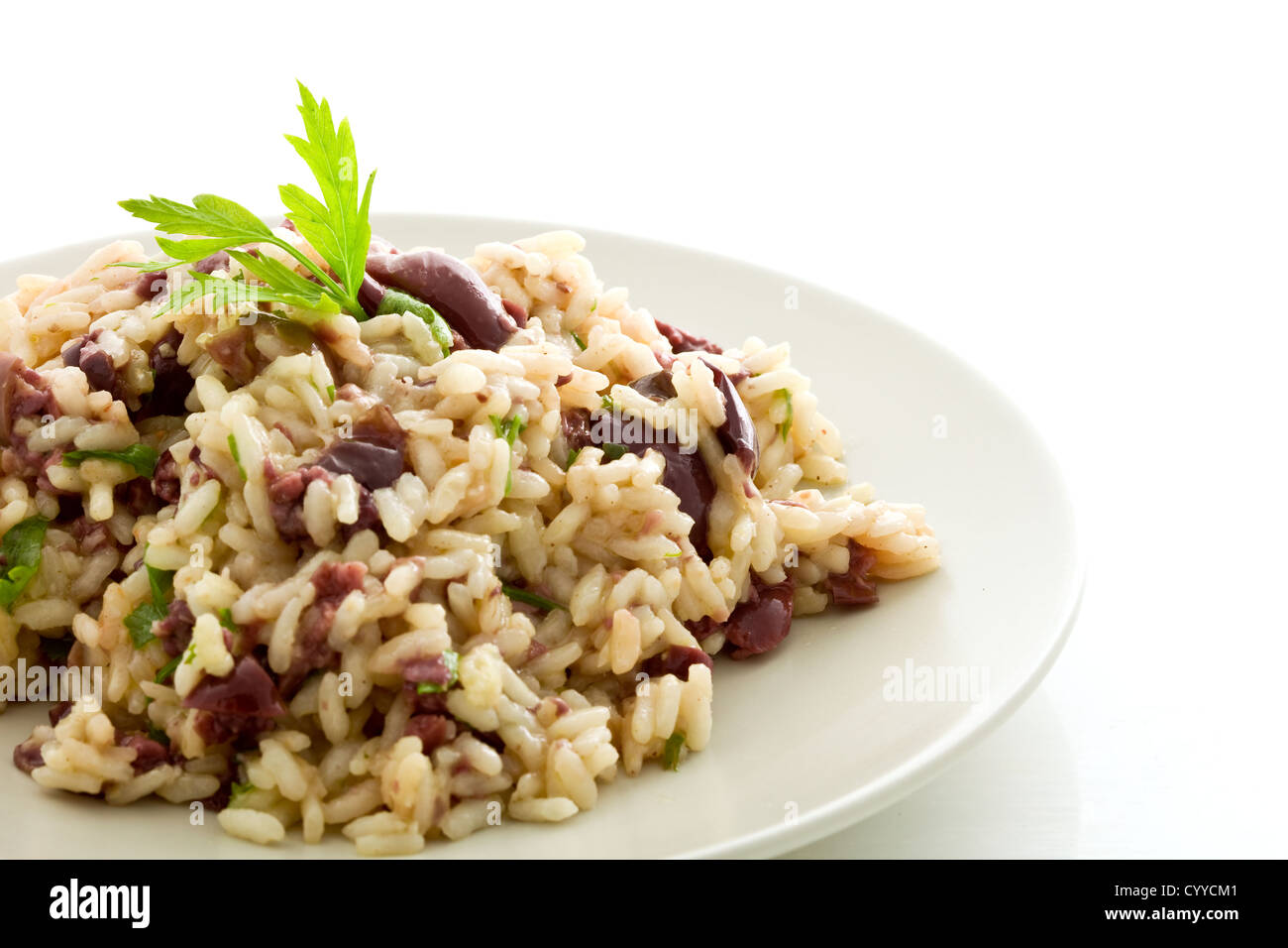 delicious risotto with black olives on white isolated background Stock ...