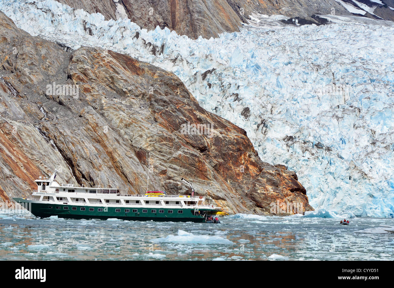 Cruise ship at the base of the North Sawyer Glacier in Alaska's Tongass National Forest. Stock Photo