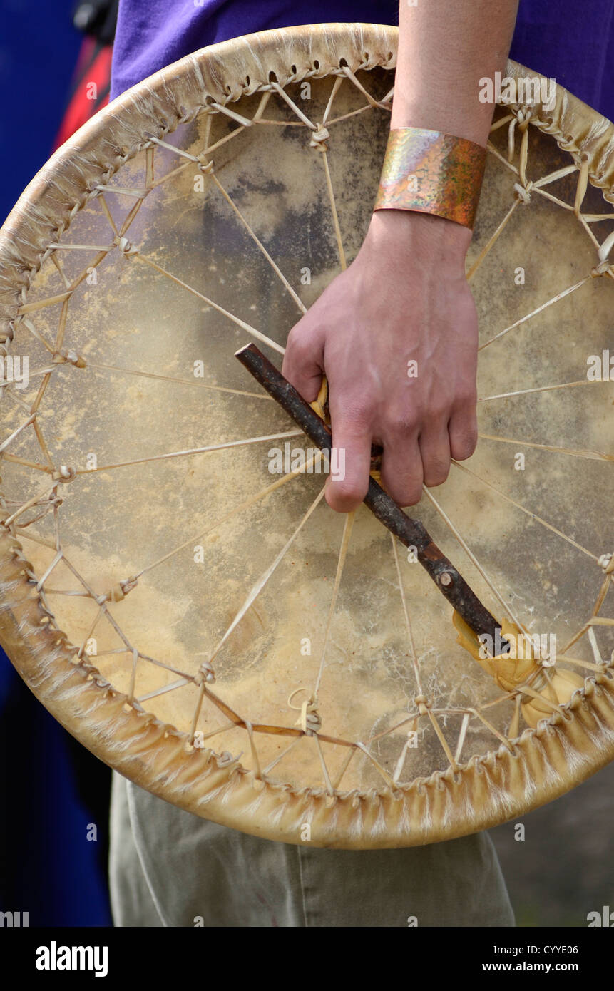 Native American holding drum at ceremony in Southeast Alaska Stock