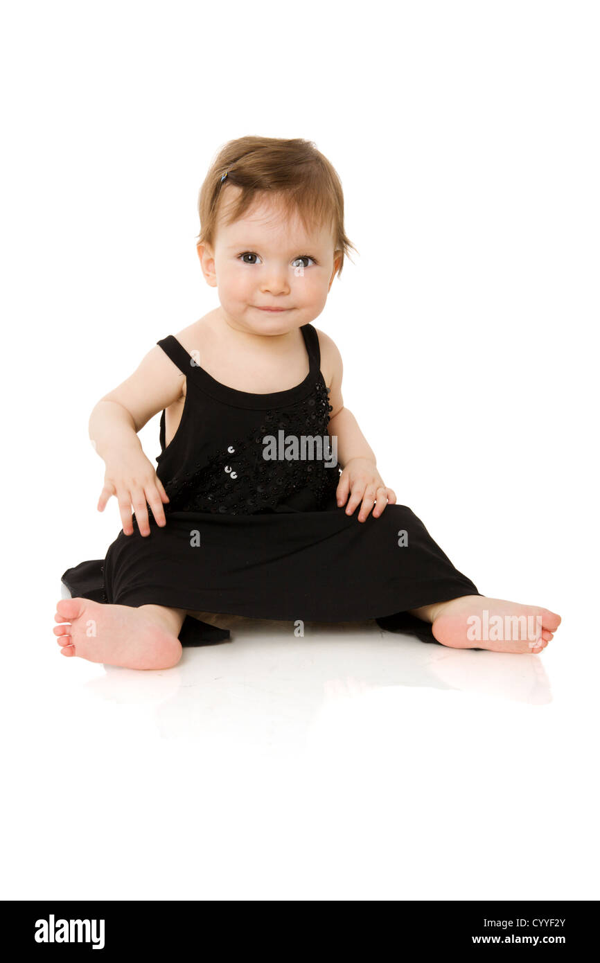 One year baby girl wearing black evening dress isolated on white Stock Photo