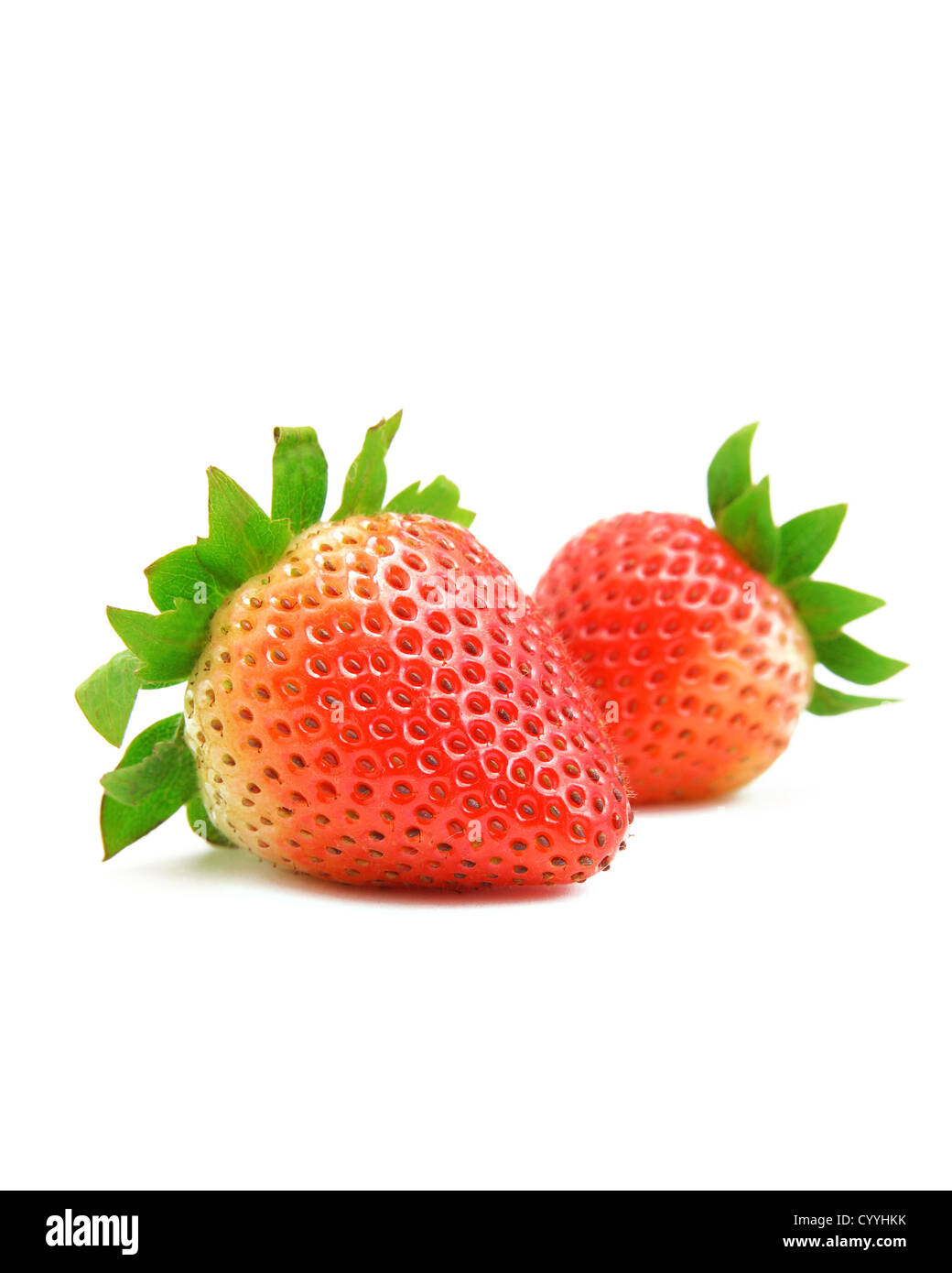 two strawberries on white background Stock Photo - Alamy