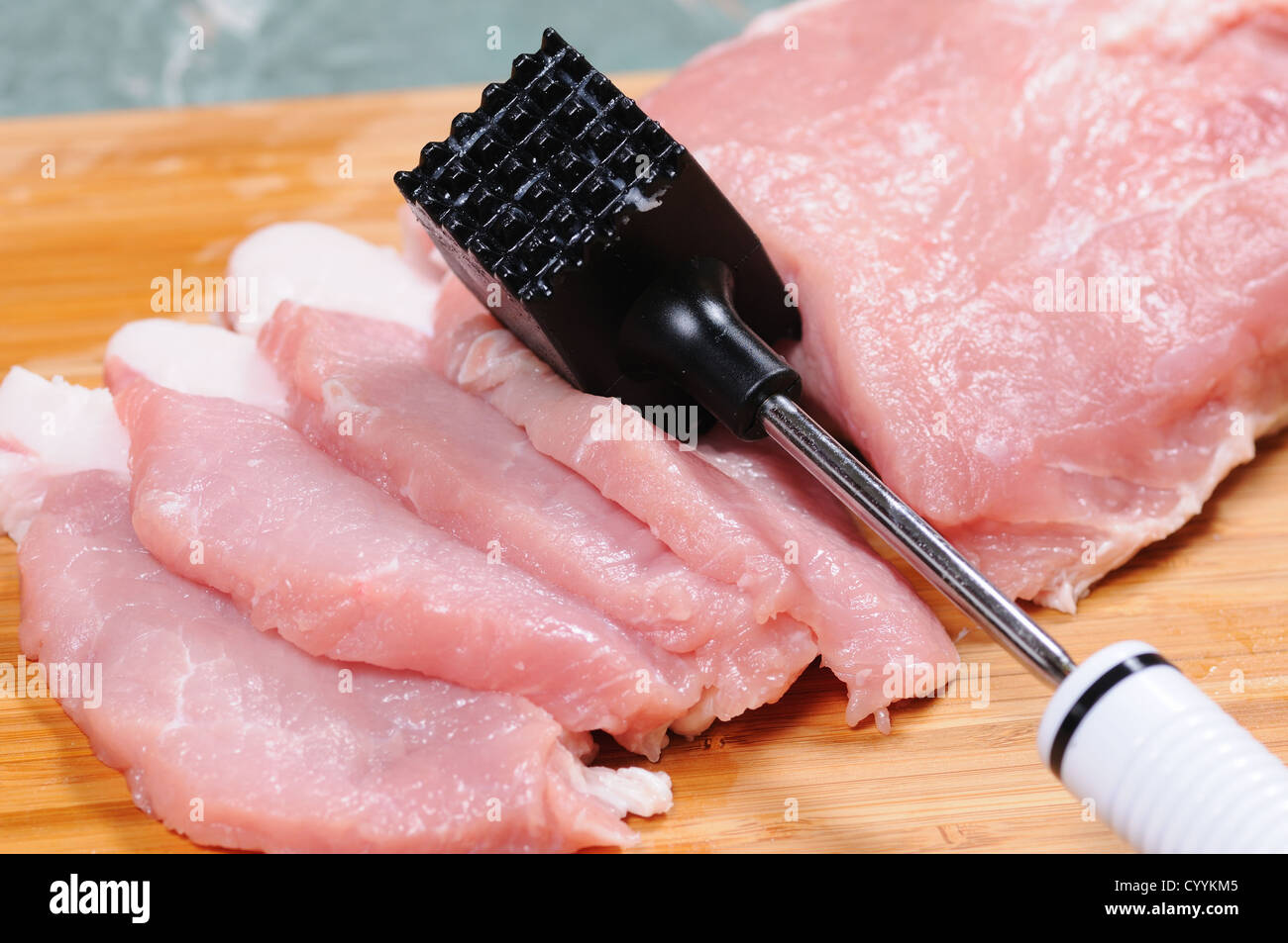 The cook prepares a chop from pork Stock Photo Alamy
