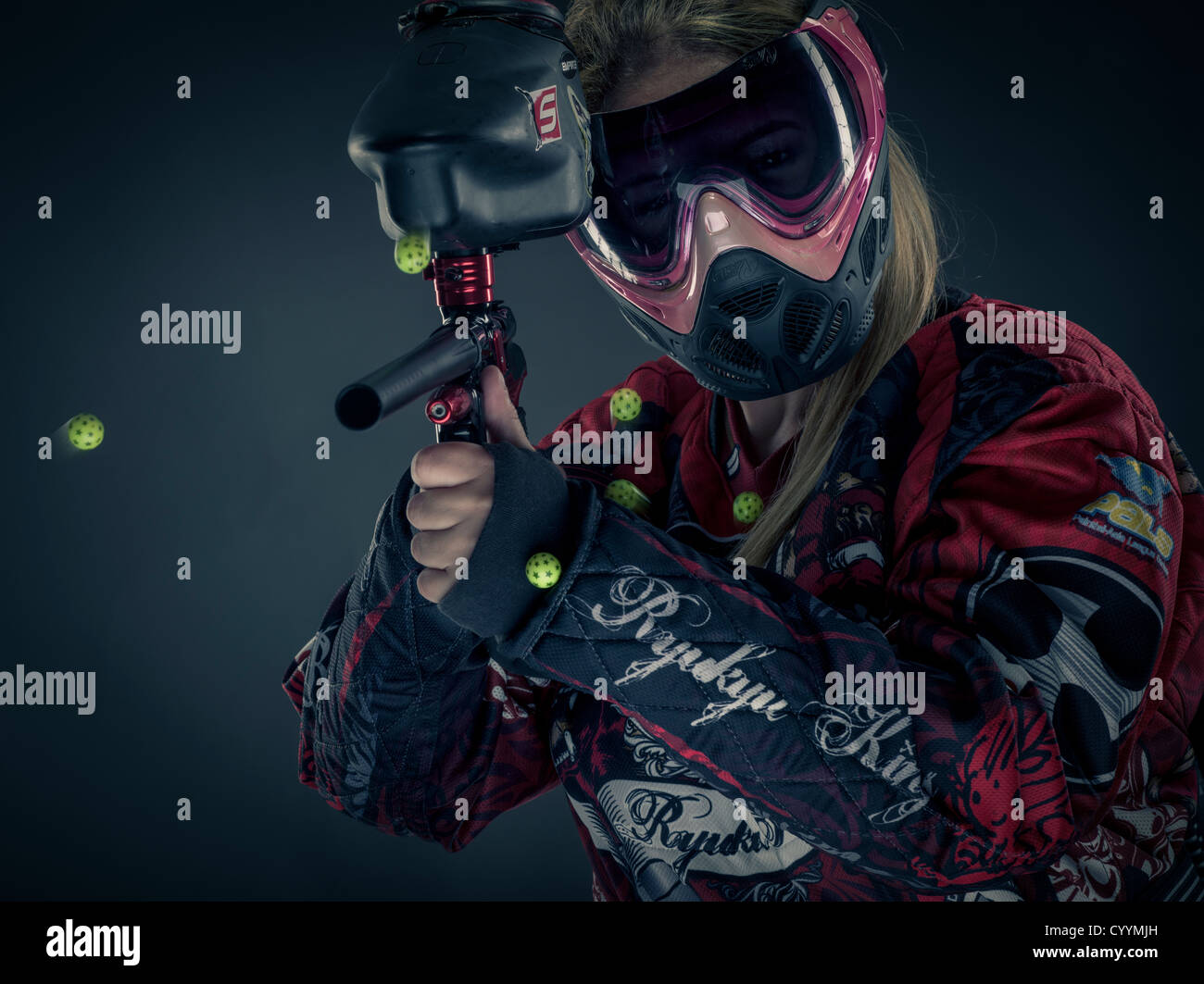 Woman Paintballer with paintball gun and body armor Stock Photo