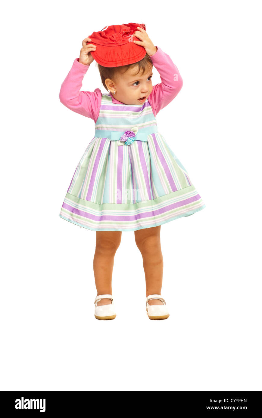 Child trying to put on hat Cut Out Stock Images & Pictures Alamy