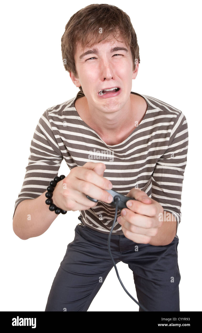 Unhappy teen plays video game gestures over white background Stock Photo