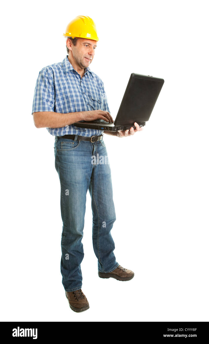 Worker wearing hard hat and using leptop Stock Photo