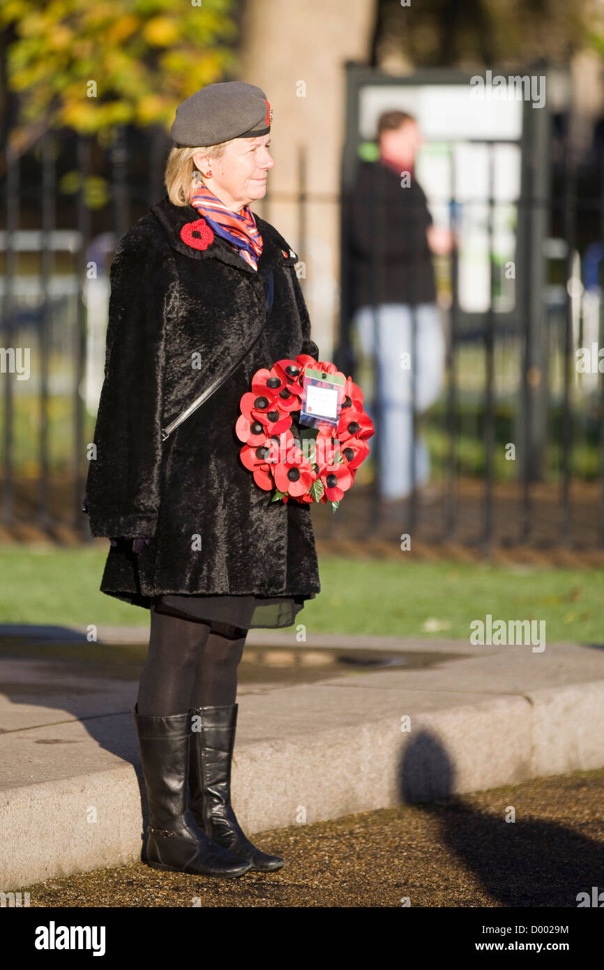A Lone woman stands in front of the Guards Memorial with a wreath of Poppy's on Remembrance Day  11 November 2012] London Stock Photo