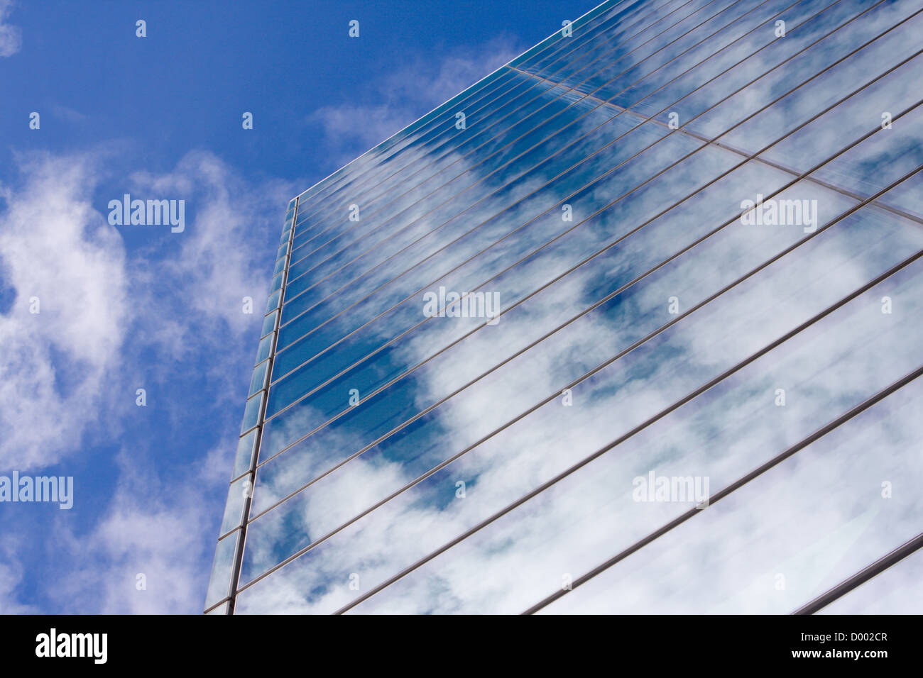 Modern glass office building reflecting the clouds Stock Photo - Alamy