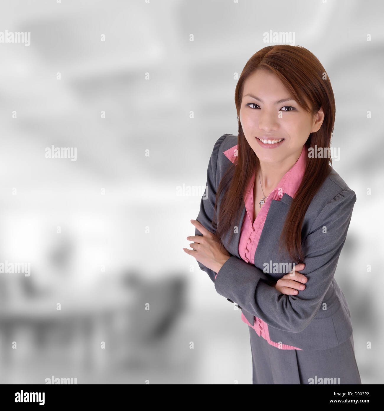 Smiling executive woman with joy in office building Stock Photo - Alamy