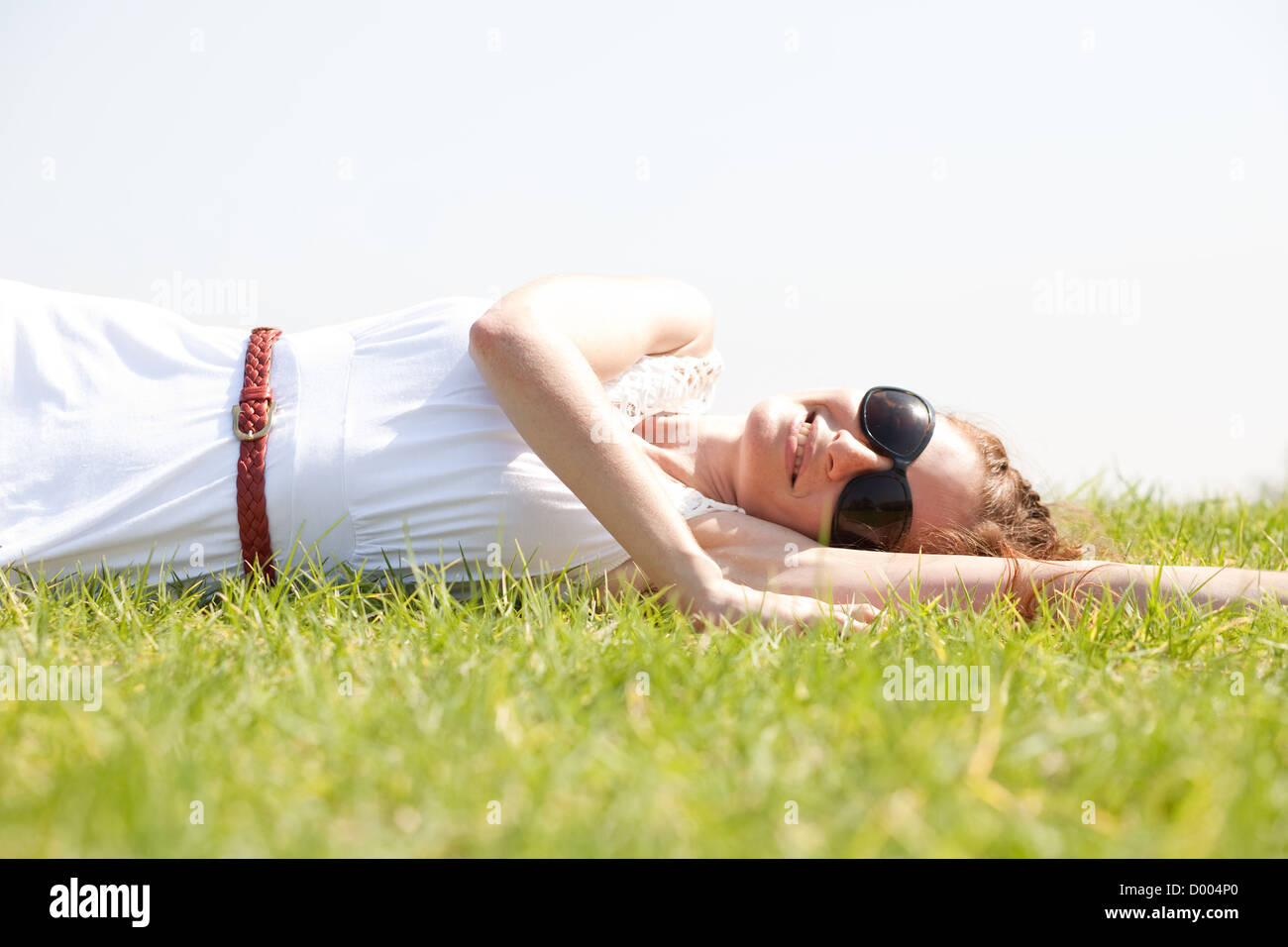women lie down on grass,Outdoor at park Stock Photo