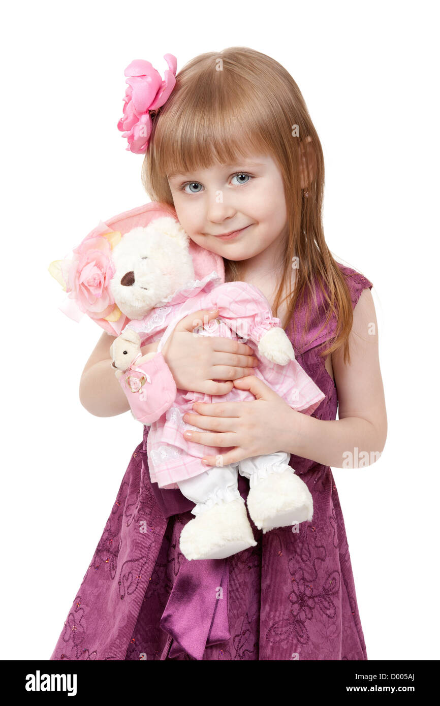 portrait of a little girl 4 years old with a plush toy bear isolated on white background Stock Photo