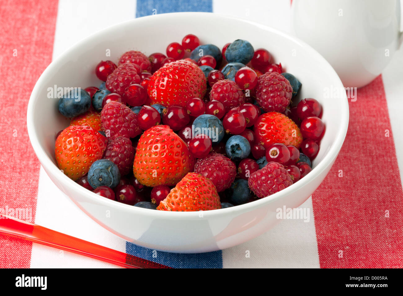 Mixed berry fruits in a bowl Stock Photo Alamy