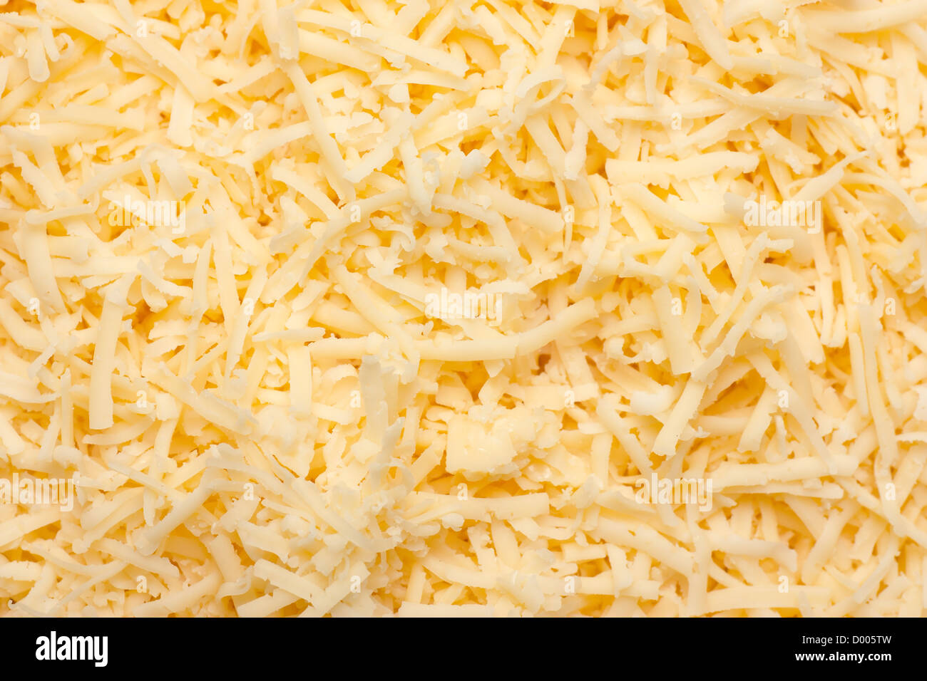 High resolution yellow grated cheese background Stock Photo Alamy