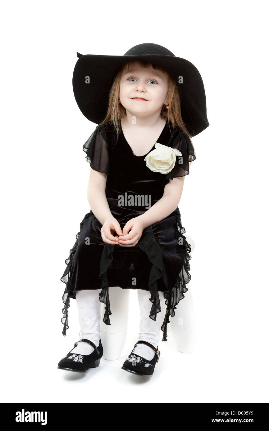 A little sweet girl a black hat with wide brim Stock Photo - Alamy