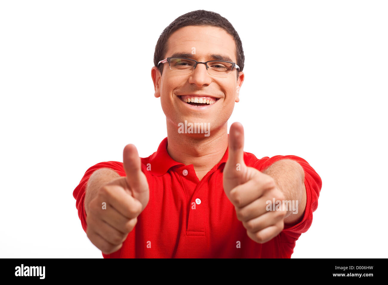 Hands of a young man showing thumbs up on a white isolated background Stock Photo