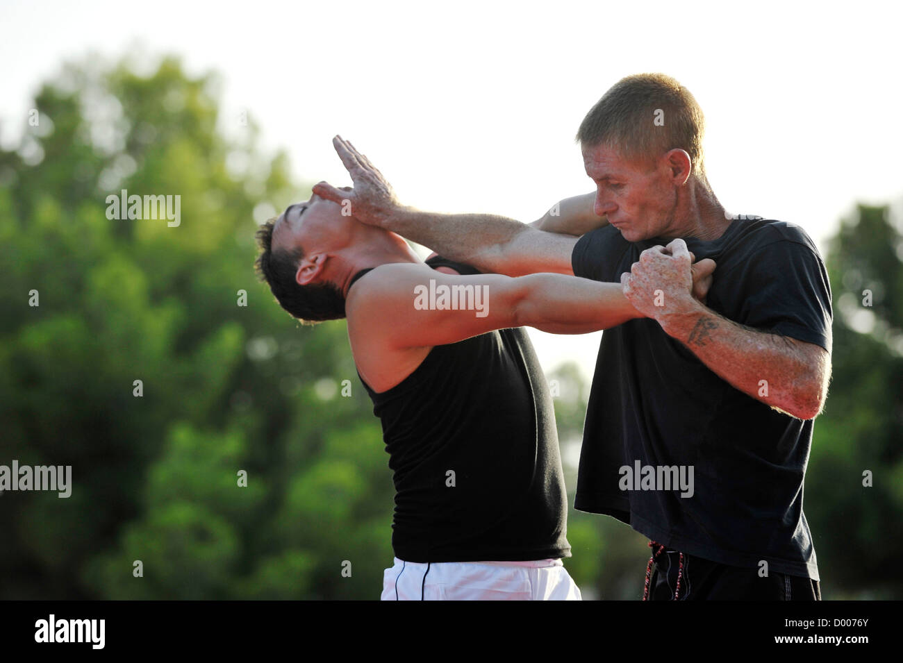 two men practice martial arts outside Stock Photo Alamy