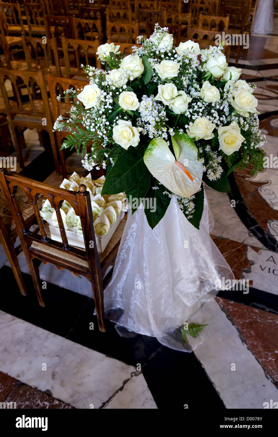 Interiors of church with floral decorations into a wedding's day Stock