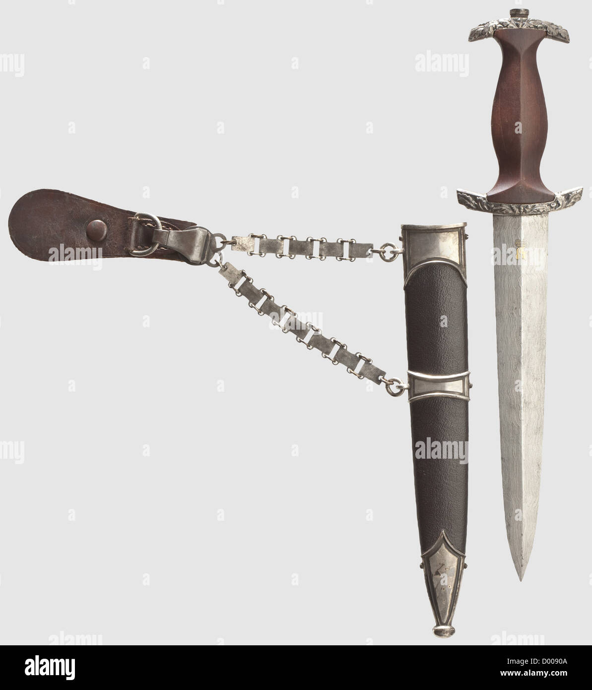 An SA high leader's honour dagger model 1938 with chain hanger,Maker Eickhorn,Solingen Damascus blade with raised,gilt motto 'Alles für Deutschland' between oak leaf branches,maker's mark 'Original Eickhorn Solingen',struck 'D' in the tang.Silver cross guard with oak leaf décor in relief,brown wooden grip with applied fine zinc eagle and enamelled SA medallion.The scabbard newly leather-covered.Iron chain hanger with engraved,silvered fittings,the central one in variant issue.Length 34.5 cm.These daggers were bestowed by Viktor Lutze upon deserving,Additional-Rights-Clearences-Not Available Stock Photo
